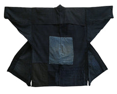 A Repaired and Mended Indigo Dyed Cotton Work Coat: Hand Stitched
